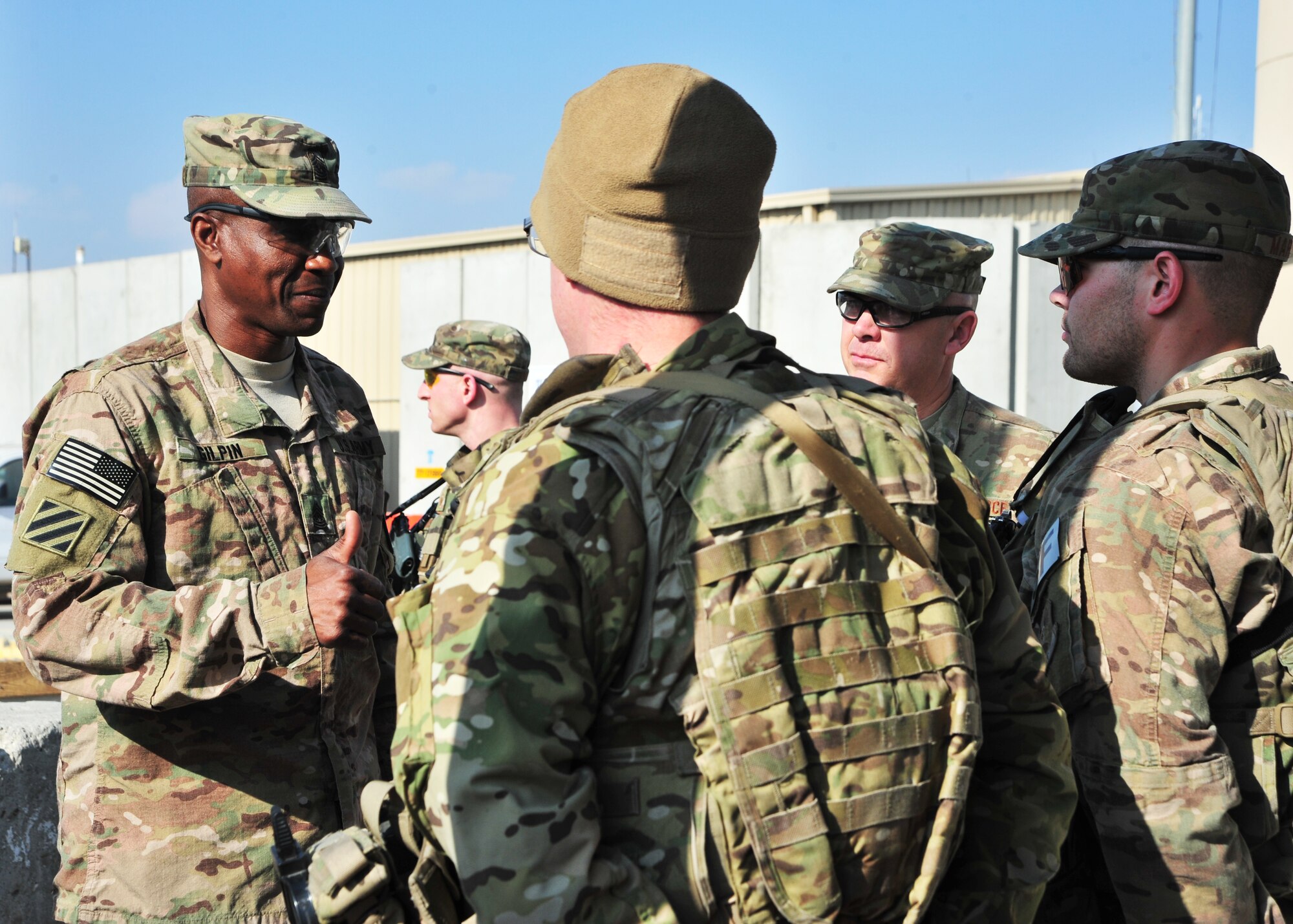 U.S. Army Command Sgt. Maj. Christopher Gilpin, Combined Joint Task Force 3 United States Forces Afghanistan, meets with Airmen assigned to the 455th Expeditionary Security Forces Squadron during a tour Jan. 6, 2015 at Bagram Airfield, Afghanistan. During the tour, Gilpin had the opportunity to meet with 455th Air Expeditionary Wing leadership and become better acquainted with Air Force assets and squadrons. (U.S. Air Force photo by Staff Sgt. Whitney Amstutz/released)