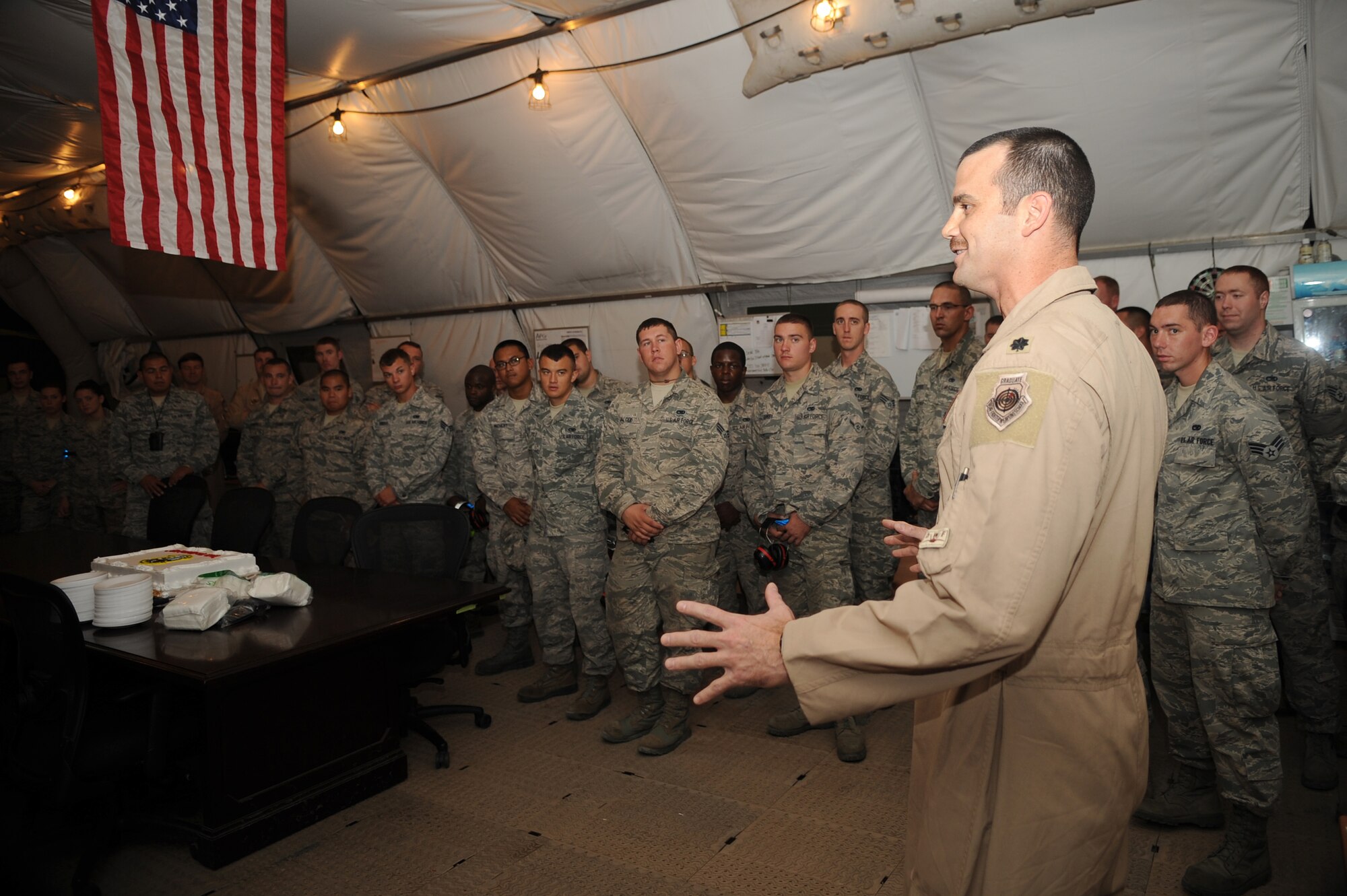 Lt. Col. Ronald Gilbert, 95th Expeditionary Fighter Squadron commander, addresses members of the Expeditionary Operations Group and Aircraft Maintenance Unit during their recent one-year anniversary celebration here Oct. 11, 2014. Members of the unit are currently deployed out of Tyndall Air Force Base, Fla. (U.S. Air Force photo by Senior Master Sgt. Carrie Hinson)