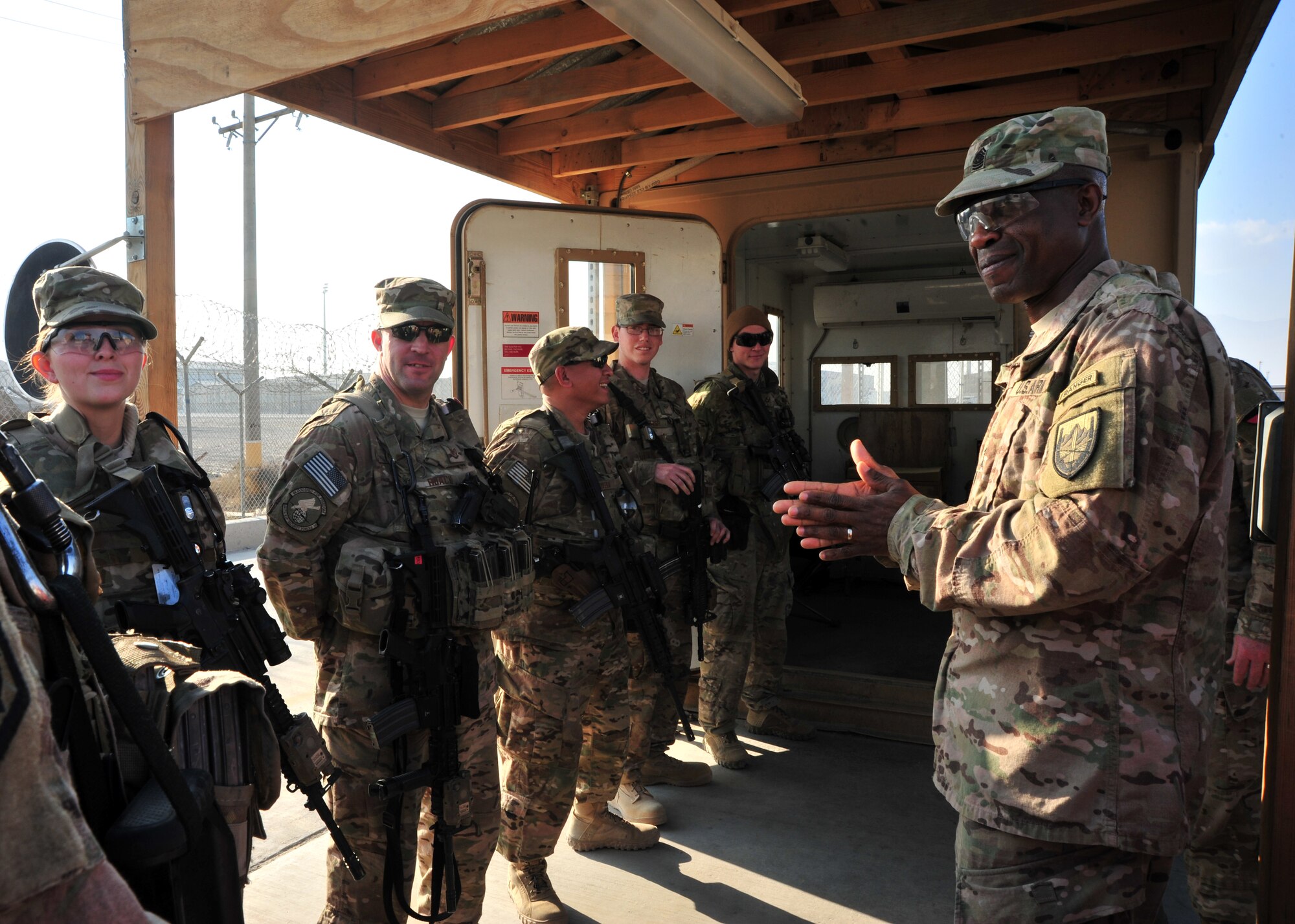 U.S. Army Command Sgt. Maj. Christopher Gilpin, Combined Joint Task Force 3 United States Forces Afghanistan, meets with defenders during a tour Jan. 6, 2015 at Bagram Airfield, Afghanistan. During the tour, Gilpin had the opportunity to meet with 455th Air Expeditionary Wing leadership and become better acquainted with Air Force assets and squadrons. (U.S. Air Force photo by Staff Sgt. Whitney Amstutz/released)