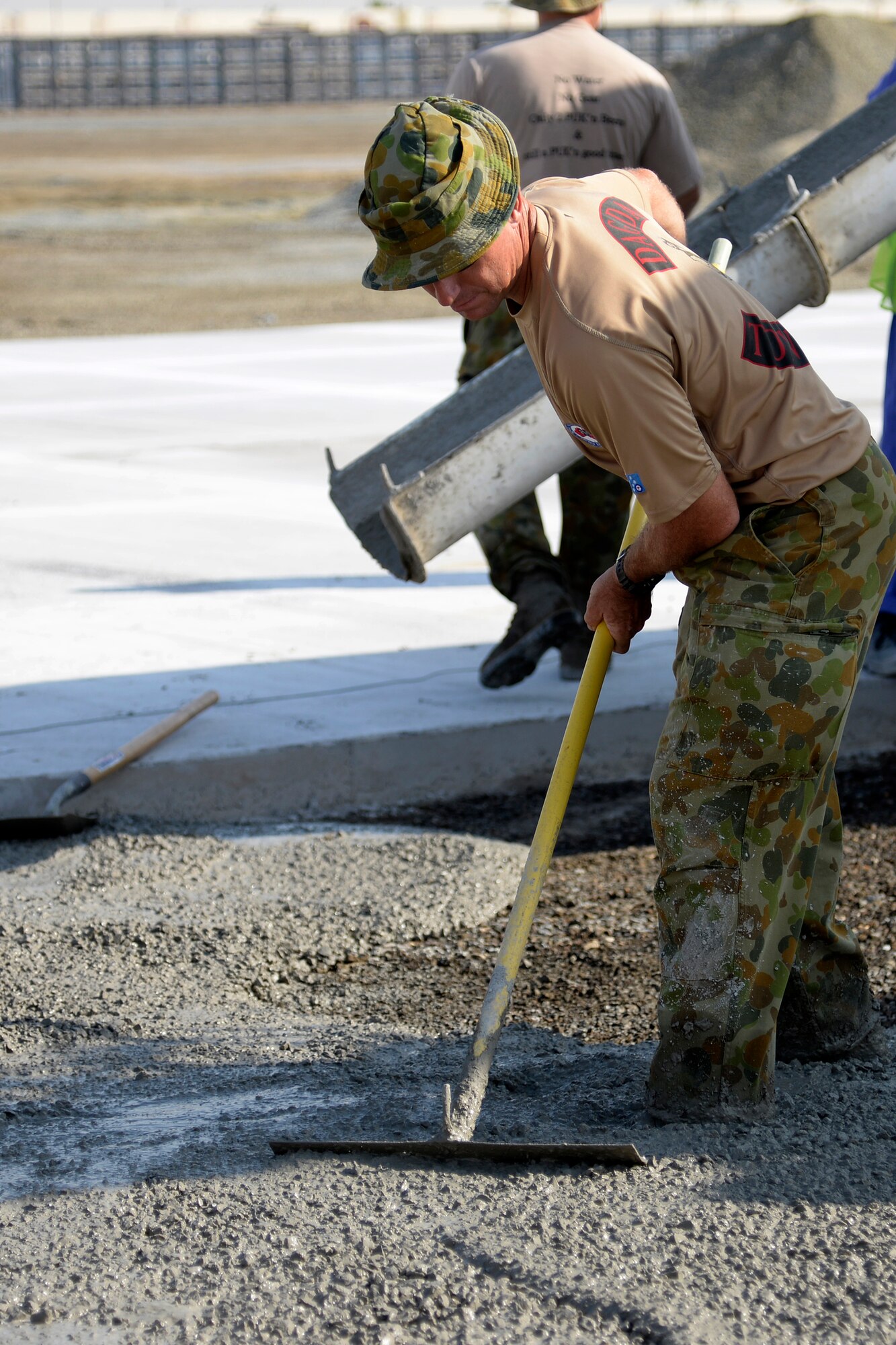 Leading Aircraftsman Greg Hill, Air Task Group carpenter, works at the Australian beddown site on an undisclosed location in Southwest Asia Oct. 30, 2014. Approximately nine members of the RAAF Air Task Group, deployed from the 383rd Squadron in Townsville, Queensland, integrated with Airmen in the Expeditionary Civil Engineer Squadron where they were able to learn different styles of training. (U.S. Air Force photo/Tech. Sgt. Marie Brown)