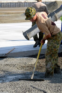 Leading Aircraftsman Greg Hill, Air Task Group carpenter, works at the Australian beddown site on an undisclosed location in Southwest Asia Oct. 30, 2014. Approximately nine members of the RAAF Air Task Group, deployed from the 383rd Squadron in Townsville, Queensland, integrated with Airmen in the Expeditionary Civil Engineer Squadron where they were able to learn different styles of training. (U.S. Air Force photo/Tech. Sgt. Marie Brown)
