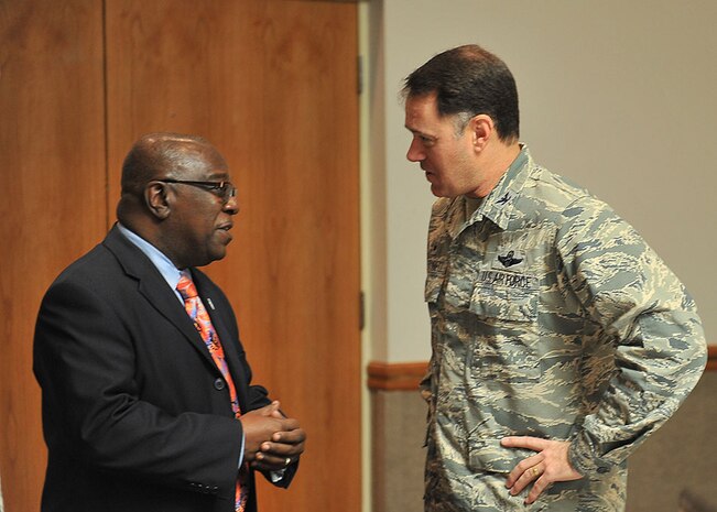 Lovinth Anderson Jr., Lake City, S.C mayor speaks to Col. Richard Boutwell, 99th Air Base Wing commander, at the Dr. Martin Luther King Jr. Commemorative Luncheon, at The Club on Nellis Air Force Base, Nev. Jan. 9, 2015. The luncheon was an event hosted by the Equal Opportunity Office in remembrance of Dr. King and all the accomplishments he achieved. Anderson was the key note speaker for the event and shared his personal stories about Dr. King. (U.S. Air Force photo by Airman 1st Class Rachel Loftis)