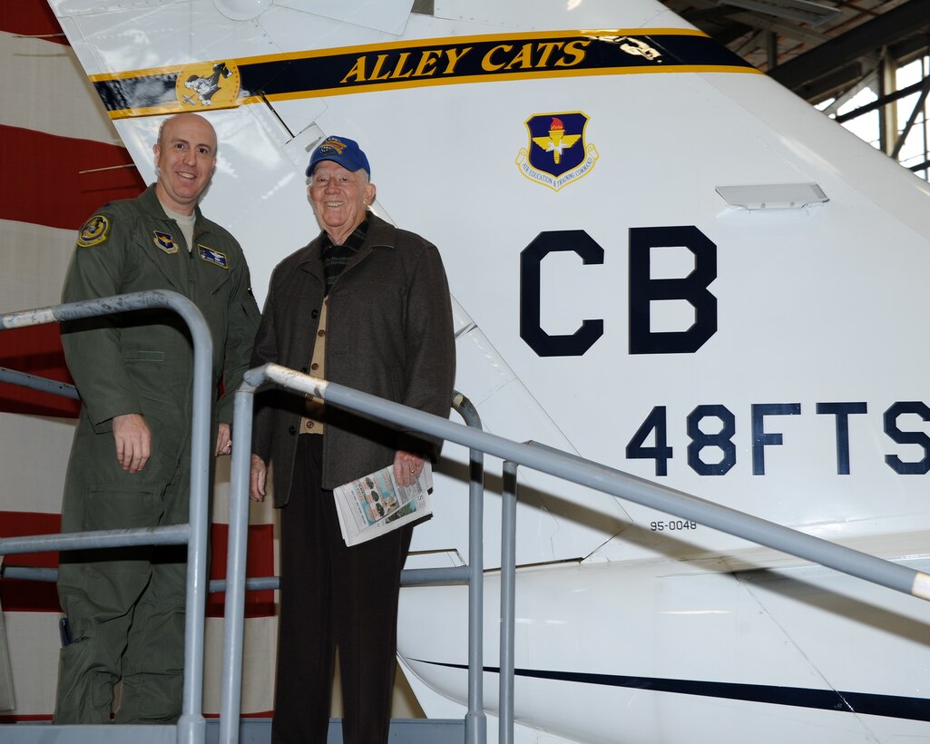 Lt. Col. Paul Baker, 48th Flying Training Squadron Commander, and Air Force retired Col. Bob Jessup, a previous member of the 48th FIS, pose for a photo at the 48th FTS’s tail flash unveiling ceremony Jan. 9 in the Walker Center at Columbus Air Force Base, Mississippi. From this day on, the T-1s of Columbus AFB will showcase the pride of the Alleycats in its new tail flash. (U.S. Air Force photo/Elizabeth Owens)
