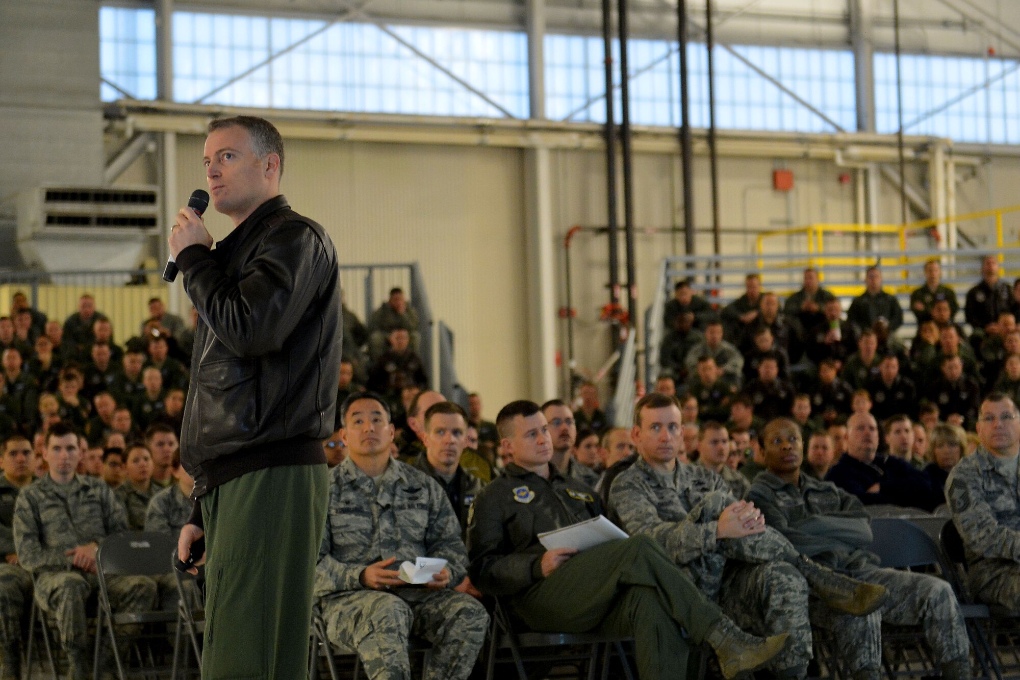 Lt. Col. Dan DeYoung (left), 62nd Airlift Wing Safety chief, speaks to Airmen and personnel about renewing their commitment to safety during Safety Down Day Jan. 8, 2015, at Joint Base Lewis-McChord, Wash. The theme of the day, “Back to Basics,” challenged Airmen to look at their day-to-day safety procedures and techniques. (U.S. Air Force photo/Senior Airman Rebecca Blossom)