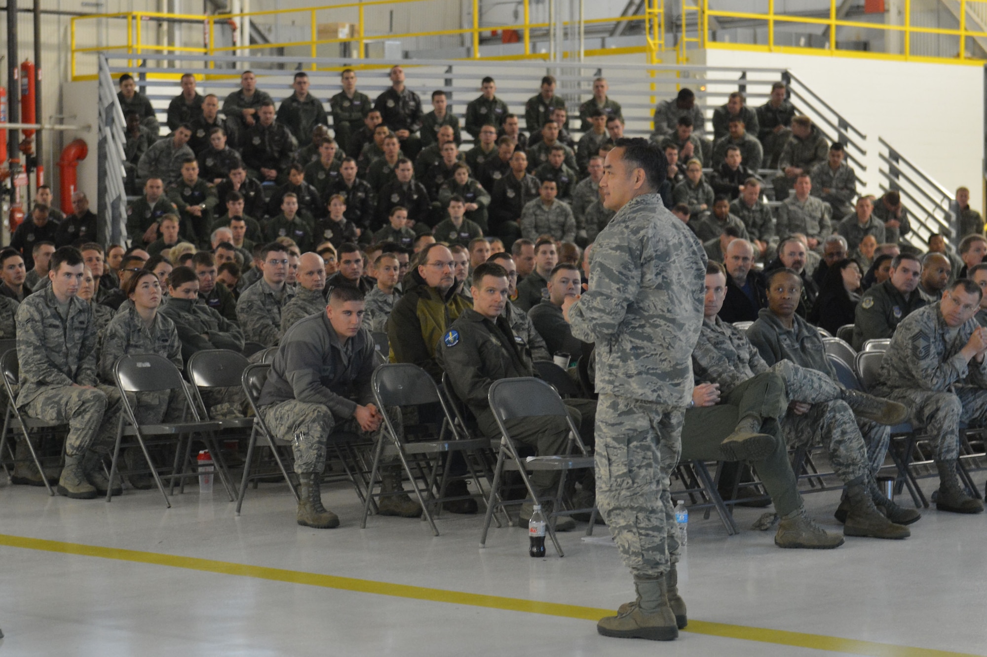 Col. David Kumashiro (right), 62nd Airlift Wing commander, emphasizes the importance of safety to Team McChord members at the close of the formal brief portion of Safety Down Day Jan. 8, 2015, at Joint Base Lewis-McChord, Wash. Members were directed to head back to their units and discuss the unqiue challenges they face in their respective work centers. (U.S. Air Force photo/Senior Airman Rebecca Blossom)