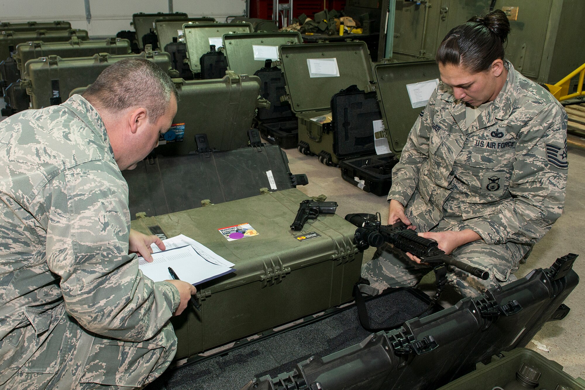 U.S. Air Force Tech. Sgt. Starlight Lesher, 307th Security Forces Squadron, reads the serial number of an M4 rifle during an inventory inspection on Jan. 6, 2015, 2015. The inspection was in preparation for a mobility exercise the 307th Bomb Wing will undergo during the January Unit Training Assembly. (U.S. Air Force photo by Master Sgt. Greg Steele/Released)