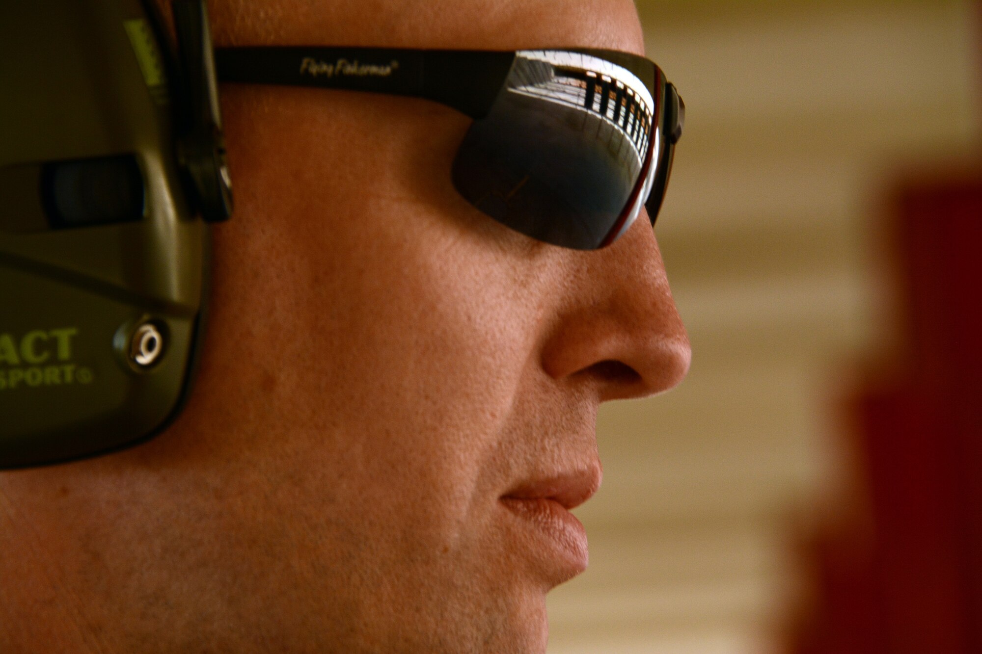 Targets on the Combat Arms firing range are reflected in an Airman's sunglasses Jan.6, 2015, at Travis Air Force Base, California.