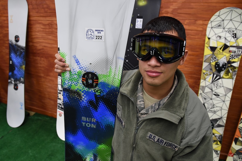 Airman 1st Class Mark A. Claborne, 11th Security Forces Squadron member, poses for a photo with winter gear at the 11th Force Support Squadron's Outdoor Recreation, Jan. 9, 2015. Claborne is renting equipment for a trip he plans to attend. (U.S. Air Force/Airman 1st Class Philip Bryant)