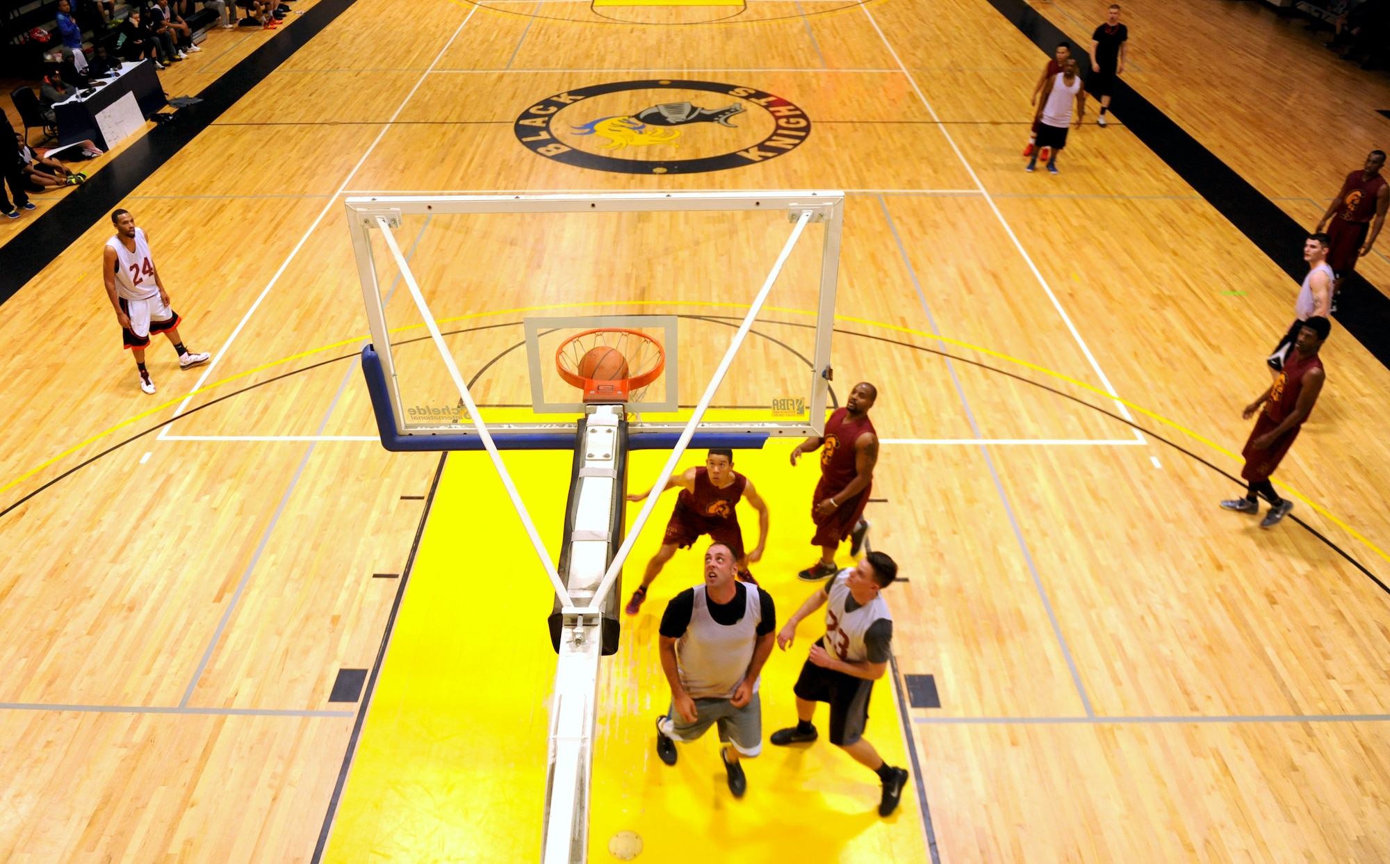 The 19th Logistics Readiness Squadron Team 1 and the 19th Medical Group Team 1 play in the pre- season intramural basketball game Jan. 5, 2015, at Little Rock Air Force Base, Ark. The 19th MDG Team 1 won the game 58-42. (U.S. Air Force photo by Senior Airman Stephanie Serrano)