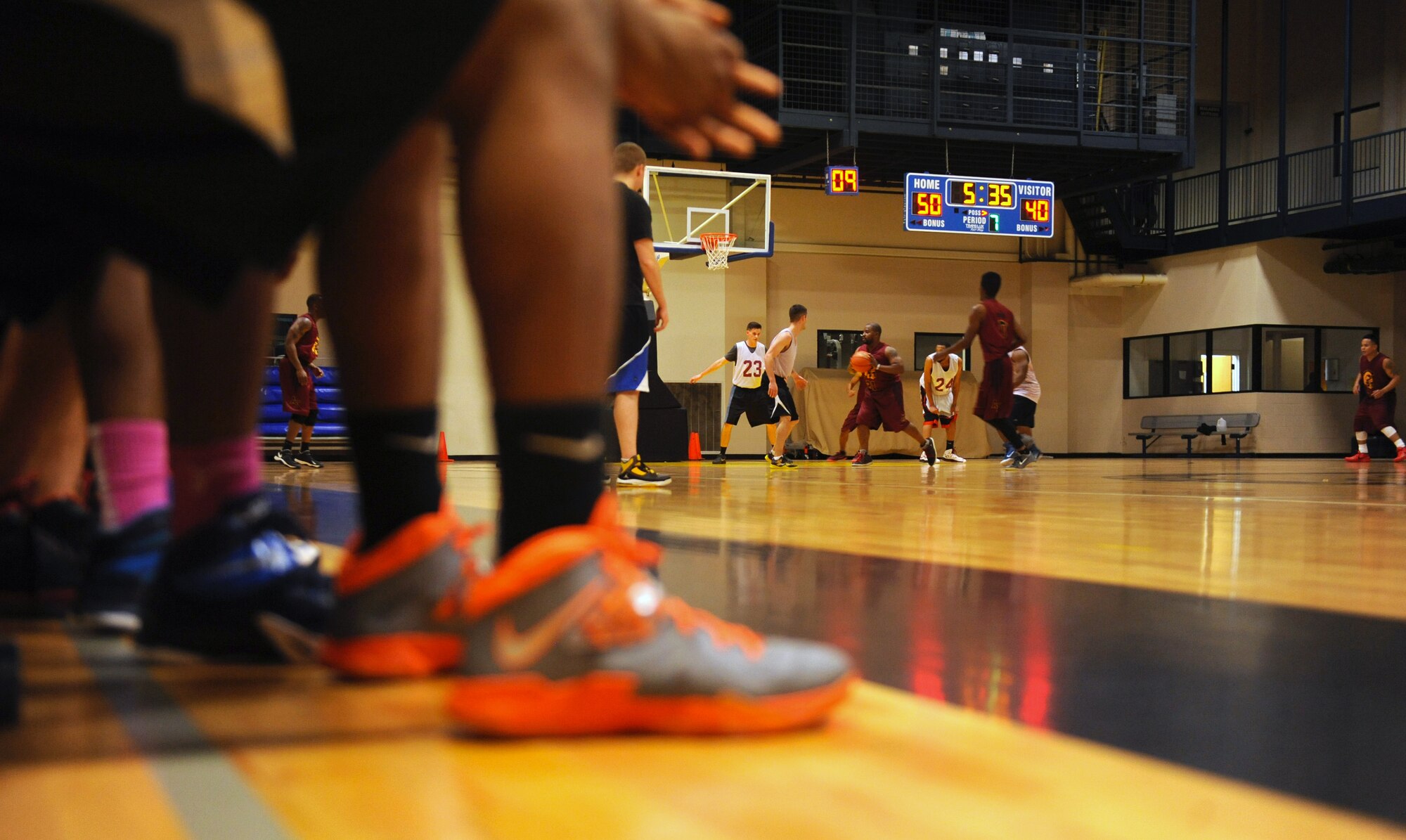 The 19th Medical Group Team 1 and the 19th Logistics Readiness Squadron Team 1 hustle during the last five minutes of the game Jan. 5, 2015, at Little Rock Air Force Base, Ark. The 19th MDG Team 1 won the game 58-42. (U.S. Air Force photo by Senior Airman Stephanie Serrano)