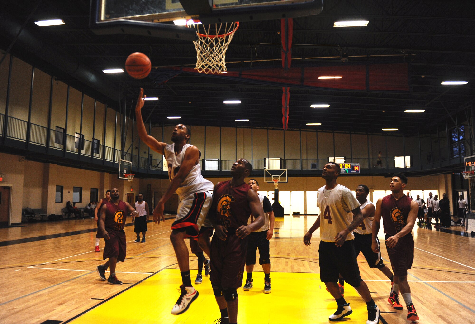 Otis James, a 19th Logistics Readiness Squadron Team 1 player, attempts a layup Jan. 5, 2015, at Little Rock Air Force Base, Ark., during a pre-season intraumural basketball game. The 19th LRS lost to the 19th Medical Group Team 1 by 16 points. (U.S. Air Force photo by Senior Airman Stephanie Serrano)