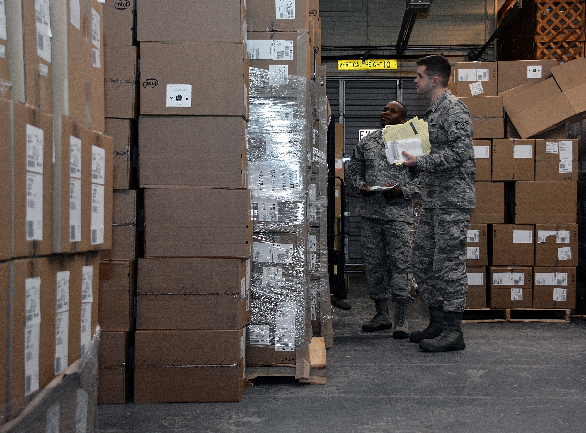 Airman 1st Class  Kyle Armour and Tech. Sgt. Francius Chery, both from the 60th Communications Squadron, conduct an inventory of the latest shipment to arrive at the information technology asset management work center Jan. 6, 2015, at Travis Air Force Base, California. Unit officials confirmed the final phase of new computer shipments and software updates are expected to conclude sometime in the early spring 2015. (U.S. Air Force photo by Senior Airman Charles Rivezzo)
