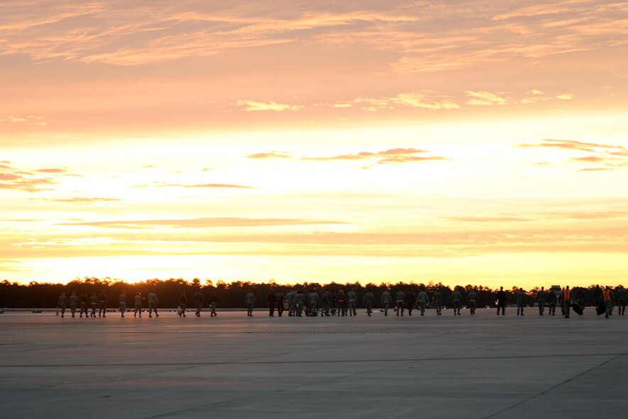 Airmen clear the flightline during the foreign object debris walk Jan. 5, 2015, at Moody Air Force Base, Ga. FOD walks are designed to assure a safe flightline for the aircraft. (U.S. Air Force photo by Airman 1st Class Kathleen D. Bryant/Released)