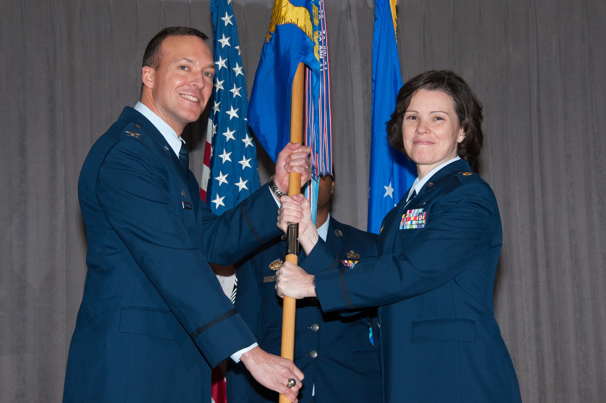 Maj. Martha Sasnett assumes command of the 42nd Force Support Squadron during an assumption of command ceremony at the Maxwell Club, Maxwell Air Force Base, Alabama, Jan. 8, 2015.  Col. Michael Borgert (pictured), 42nd Mission Support Group commander, presided over the ceremony.  (US Air Force Photo by Melanie Rodgers Cox/Cleared)

