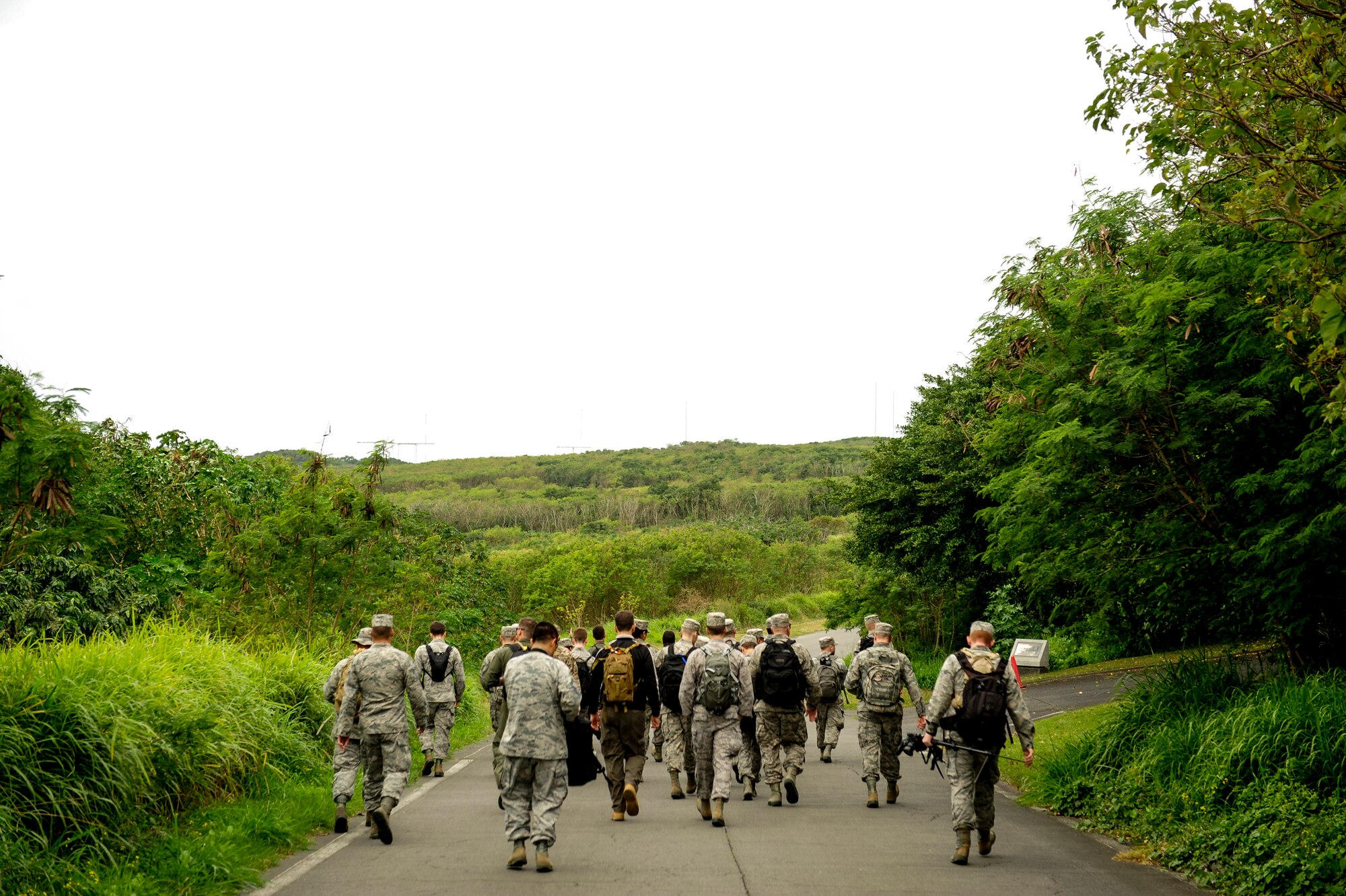 Airmen from Kadena Air Base, Japan, embark on a hike toward Mount Suribachi, Jan. 8, 2015, on Iwo To, Japan.  The Airmen arrived on an aircraft that conducted a training mission to the island. They hiked approximately 10 miles through the south side of the island to pay homage to the fallen heroes of Iwo Jima. (U.S. Air Force photo by Airman 1st Class John Linzmeier)