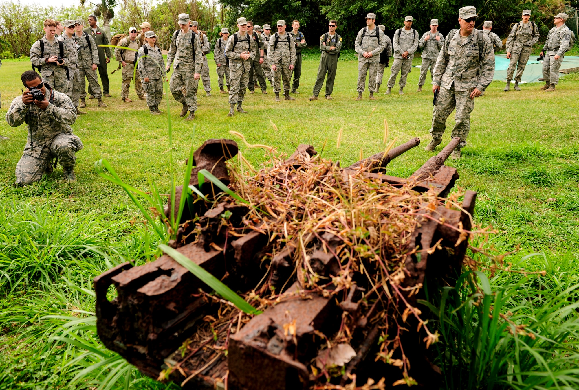 Airmen from Kadena Air Base, Japan, gather around a rusted Type 96 Imperial Japanese Navy 25mm dual-purpose anti-tank/anti-aircraft gun Jan. 8, 2015, on Iwo To, Japan. The island was previously known as Iwo Jima and was the battleground of the largest assault in U.S. Marine Corps history, lasting 36 days and having more than 26,000 Japanese and American casualties. The Airmen traveled on an aircraft conducting a training mission with Iwo To enroute. (U.S. Air Force photo by Airman 1st Class John Linzmeier)