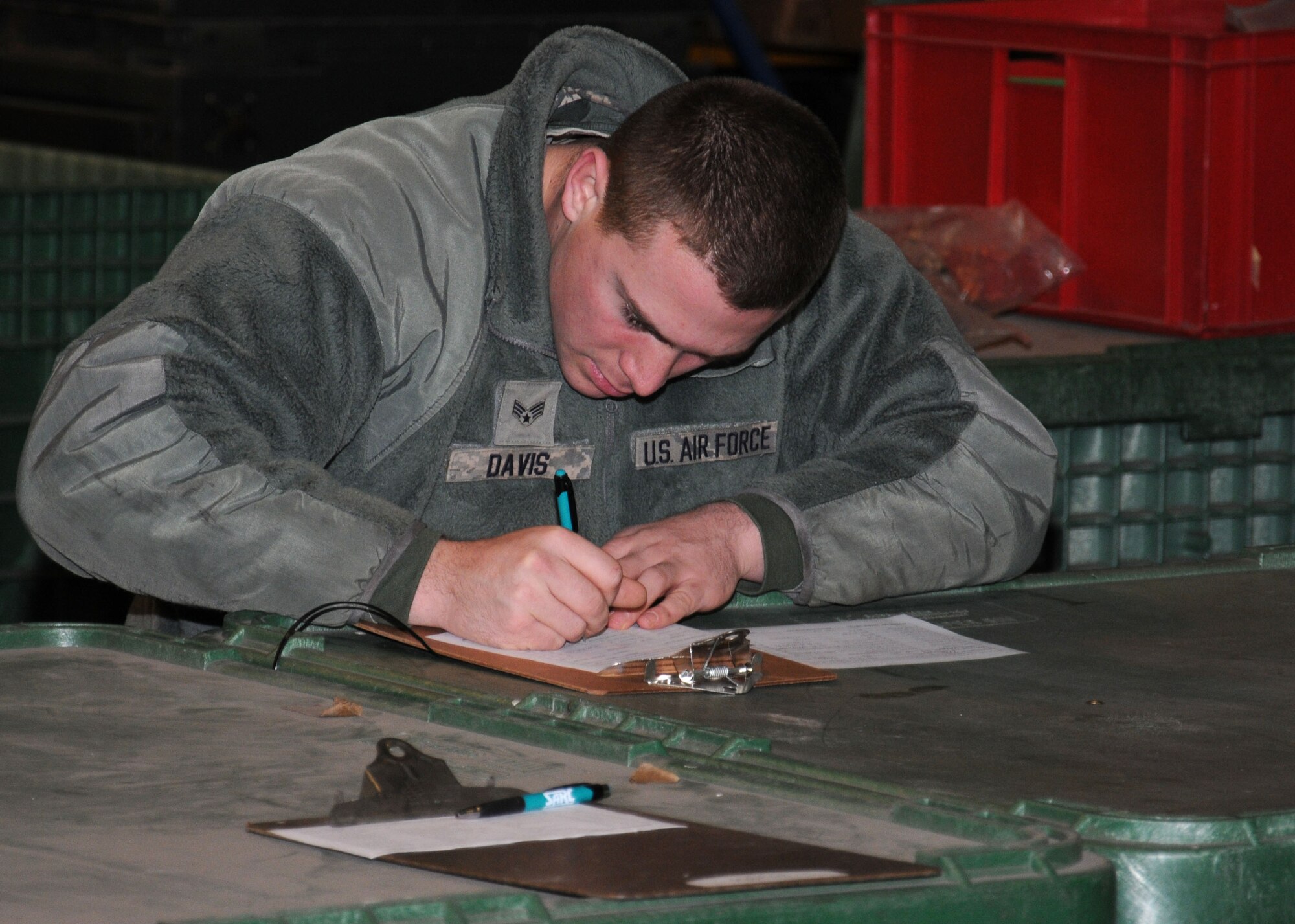 U.S. Air Force Senior Airman Maxwell Davis, 100th Civil Engineer Squadron Heavy Equipment operator from Bakersfield, Calif., takes part in an operational readiness exercise Jan. 7, 2015, on RAF Mildenhall, England. Davis ensured his paperwork was correct and that his issued equipment was accounted for. (U.S. Air Force photo by Gina Randall/Released)