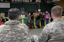 (Left) U.S. Army Gen. Curtis M. Scaparrotti, United Nations Command, Combined Forces Command, and U.S. Forces Korea commander, and U.S. Air Force Col. Ken “Wolf” Ekman, 8th Fighter Wing commander, watch as the Kunsan Sexual Assault Theater Group performs a skit at Kunsan Air Base, Republic of Korea, Jan. 9, 2015. The SATG is comprised of volunteers whose goal is to educate Airmen on sexual assault prevention using scenario-based presentations. (U.S. Air Force photo by Senior Airman Taylor Curry/Released) 