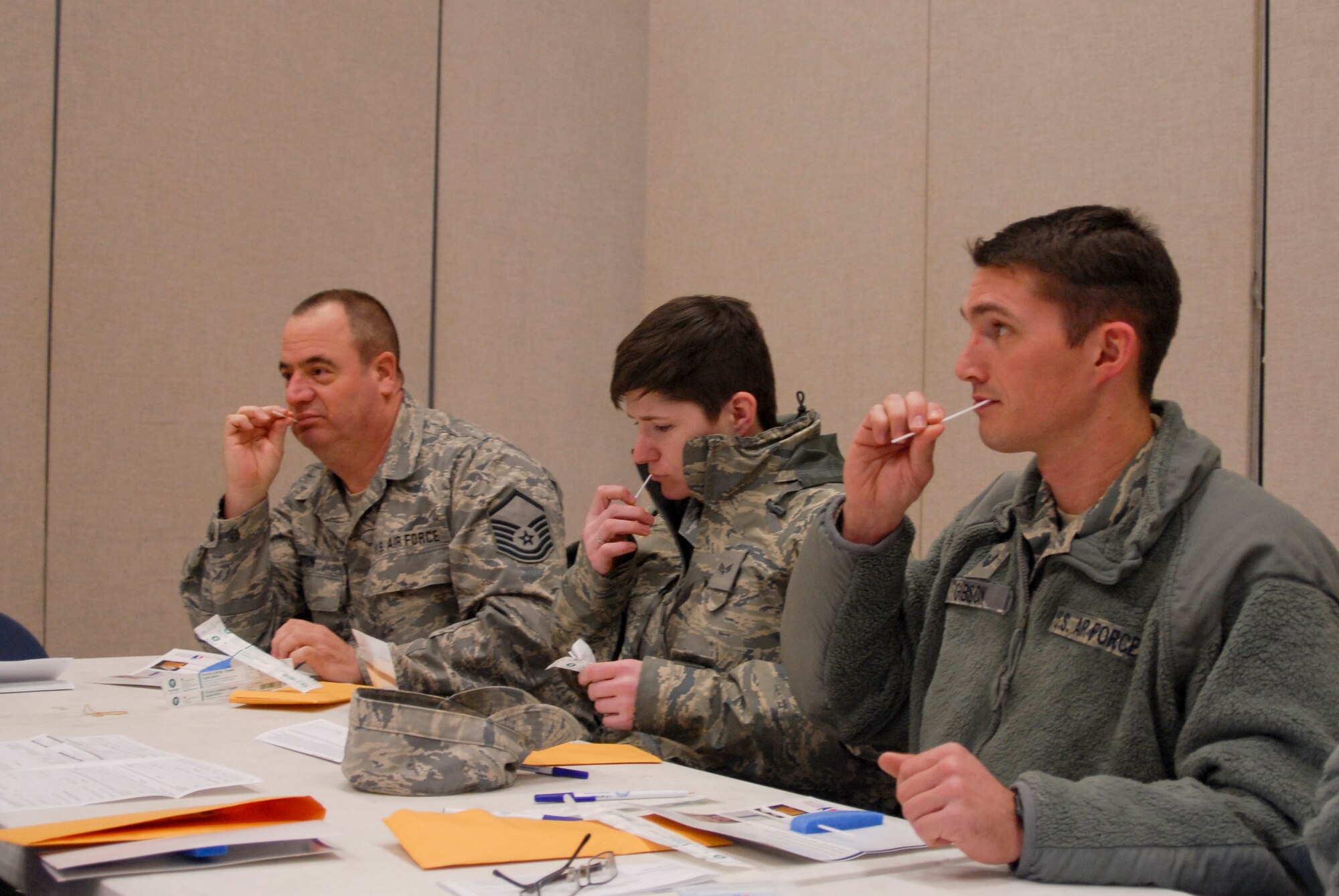 U.S. Air Force Airmen from the 180th Fighter Wing swab the inside of their cheek for the registration process during the wing's two-day bone marrow registration drive Jan. 10 2015, part of the Salute to Life Program. The Salute to Life Program, also known as the C.W. Bill Young/Department of Defense Marrow Donor Program, works with active duty and their dependents, guard, reservist and Department of Defense civilian employees to facilitate marrow and stem cell donations. All of the donors are volunteers and since the program inception in 1991, more than 750,000 individuals to fight against blood cancer and other fatal diseases.  Air National Guard photo by Senior Master Sgt. Beth Holliker (Released)