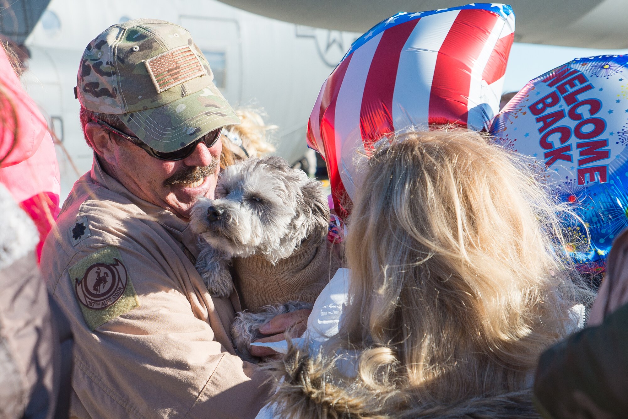 Family members welcome home U.S. Air Force Airmen from the 153rd Airlift Wing, Wyoming Air National Guard Jan. 8, 2015 at Cheyenne Air National Guard Base in Cheyenne, Wyoming. Around 60 members of the 153rd Airlift Wing, Wyoming Air National Guard, returned home this week following a two-month deployment to Southwest Asia.