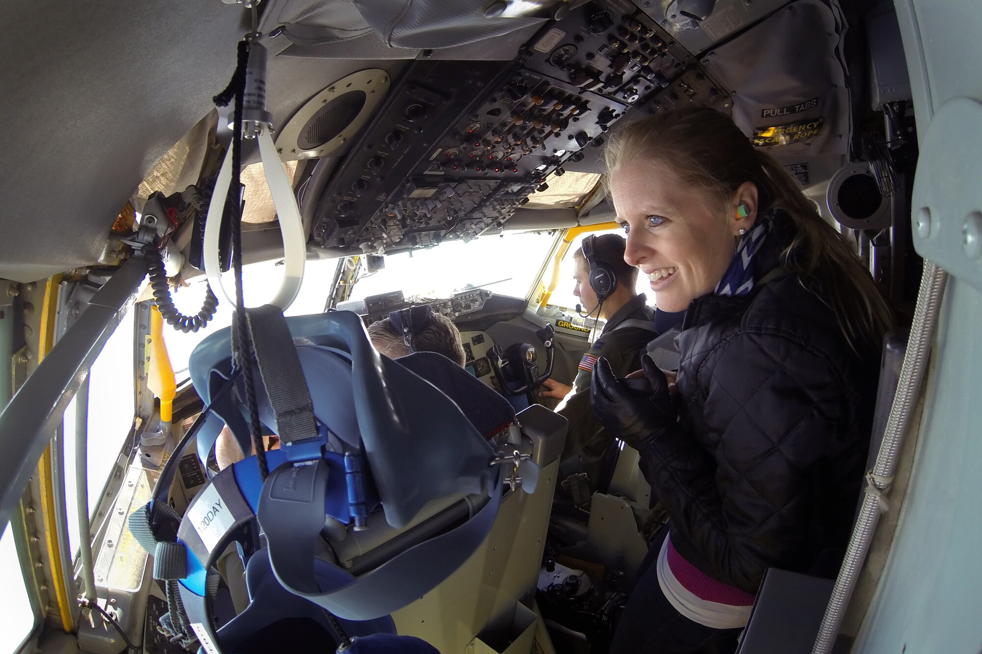 Capt. Brandon McSwain and Capt. Patrick Godfrey fly a KC-135 Stratotanker from the 916th Air Refueling Wing, Seymour Johnson Air Force Base, North Carolina, while a guest observes from behind the cockpit, Dec. 6, 2014. Guests were part of a 916th ARW Employer Support of the Guard and Reserve event, which allowed employers of traditional Reservists to fly in the KC-135 and observe flight crew members at work. (U.S. Air Force photo by Master Sgt. Wendy Lopedote)    
