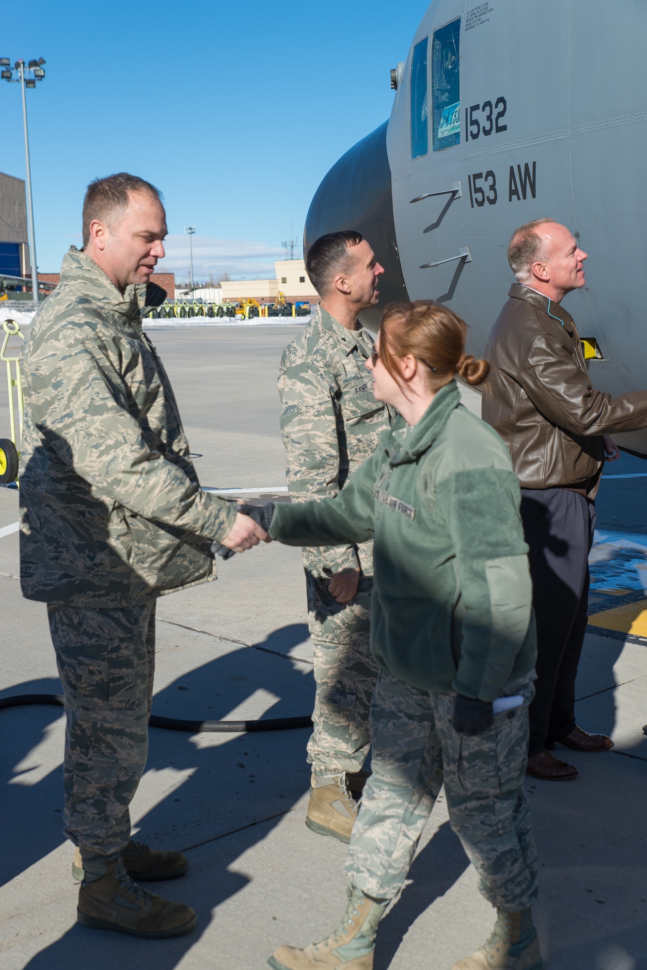 153rd Airlift Wing Commander Col. Bradley Swanson welcomes home Staff Sgt. Chelsea Nelson Jan. 8, 2015 at Cheyenne Air National Guard Base in Cheyenne, Wyoming. Around 60 members of the 153rd Airlift Wing, Wyoming Air National Guard, returned home this week following a two-month deployment to Southwest Asia