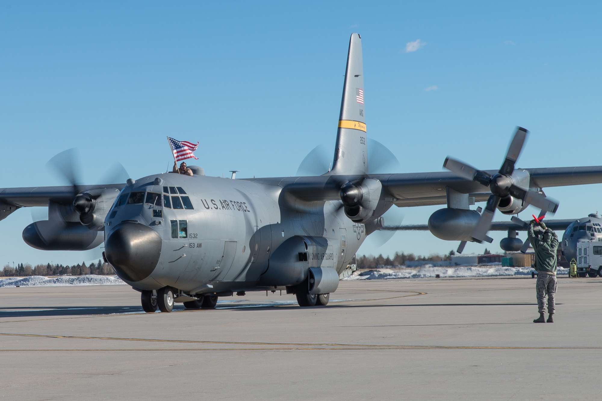 A U.S. Air Force C-130H Hercules aircraft parks on the ramp at Cheyenne Air National Guard Base in Cheyenne, Wyoming. Around 60 members of the 153rd Airlift Wing, Wyoming Air National Guard, returned home this week following a two-month deployment to Southwest Asia