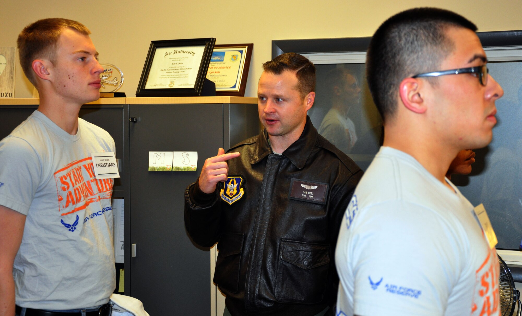 Tech. Sgt. Daniel Mills, a refueling boom operator assigned to the Air Force Reserve 18th Air Refueling Squadron, 931st Air Refueling Group, McConnell Air Force Base, Kan., instructs members of the 931 ARG's Development and Training Flight on proper facing movements during the January Unit Training Assembly, Jan. 10, 2015.  The Development and Training Flight helps prepare future Airmen for Basic Military Training and assists them with making the transition from civilian to military life.  (U.S. Air Force photo by Capt. Zach Anderson)