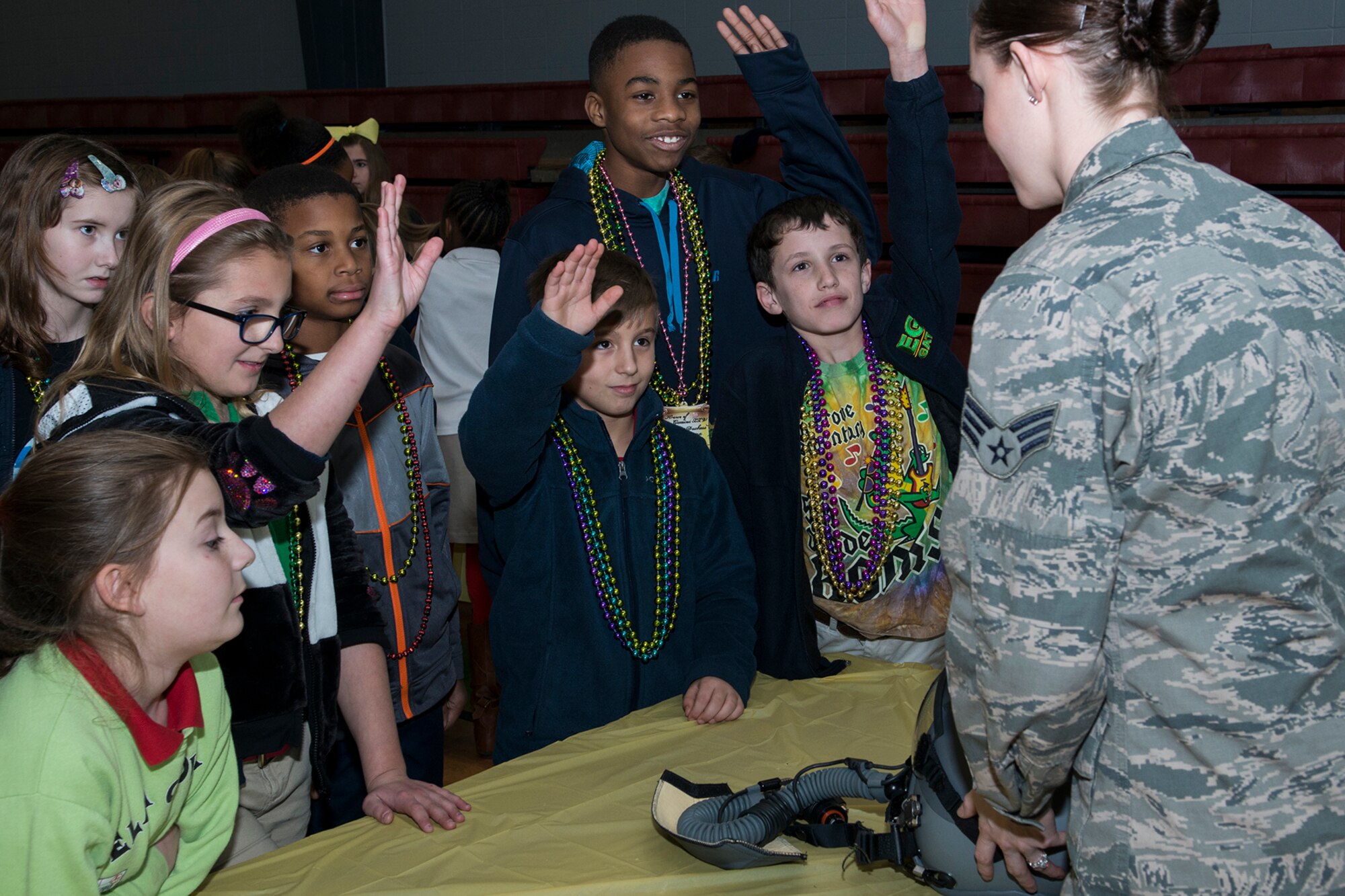 U.S. Air Force Senior Airman Meagan Kay, 307th Operations Support Squadron (OSS) aircrew flight equipment technician, takes questions from a group of Elm Grove Elementary students on Jan. 7, 2015, Bossier City, La. The 307th OSS was invited to participate in the school's Science, Technology, Engineering and Mathematics Career Day. (U.S. Air Force photo by Master Sgt. Greg Steele/Released)
