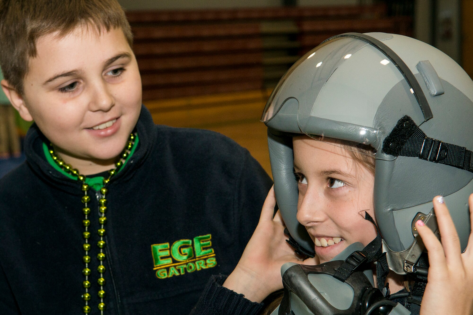 An Elm Grove Elementary student tries on an Air Force aircrew helmet during a Career Day held on Jan. 7, 2015, Bossier City, La. Airmen assigned to the 307th Operations Support Squadron aircrew flight equipment shop, participated in the event, which focused on careers in Science, Technology, Engineering and Mathematics. (Master Sgt. Greg Steele/Released)