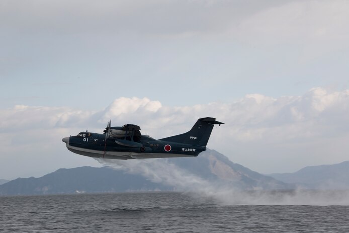 A Japan Maritime Self-Defense Force ShinMaywa US-2 takes flight from the water during the JMSDF Fleet Air Wing 31’s first flight training of the year aboard Marine Corps Air Station Iwakuni, Japan, Jan. 7, 2015. In the Japanese culture they believe a successful first flight brings good fortune for the rest of the year.