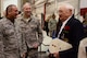 William B. Hughey, a WWII veteran speaks to Reservists after being presented with the Army Good Conduct Medal by Col. Brett Clark, 94th Airlift Wing, commander at a Wing commanders call on Dobbins Air Reserve Base, Ga. Jan. 10, 2015. Hughey served in the U.S. Army Air Corps as a ball turret gunner in the 487th Bomb Group, aboard the Boeing B17 in 1944. He successfully completed 35 combat flying missions. (U.S. Air Force photo/Don Peek)