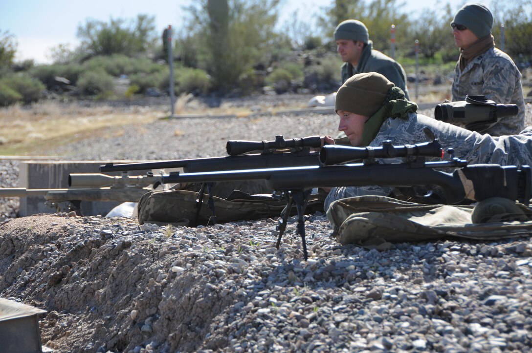 Senior Airman Kyle Drzewiecki, 161st Security Forces Squadron Advanced Designated Marksmen, hones his newly acquired skills at the shooting range in Florence, Ariz., Jan. 9, 2015. ADM Airmen, or “snipers”, deliver long-range direct fire out to 600 meters and provide enhanced situational awareness through observation and reporting in peacetime and contingency operations. The 161st Security Forces Squadron is one of only eight units of the more than 100 Air National Guard units which currently have trained/qualified advanced designated marksmen. To become a certified Air Force advanced designated marksman, Airmen must attend the ADM course at Ft. Bliss, El Paso, Texas. The 11-day course familiarizes Airmen with the M24 weapon system and teaches target detection, along with distance and windage estimation. “The hardest part of being an ADM can be the mental aspect,” said Drzewiecki. “You start planning the shot in your mind, which gets your heart rate up and then you’ve got to take the shot; you’ve got to be mentally strong and calm yourself down. You can’t get flustered easily.” (U.S. Air National Guard photo by Tech. Sgt. Courtney Enos/Released)