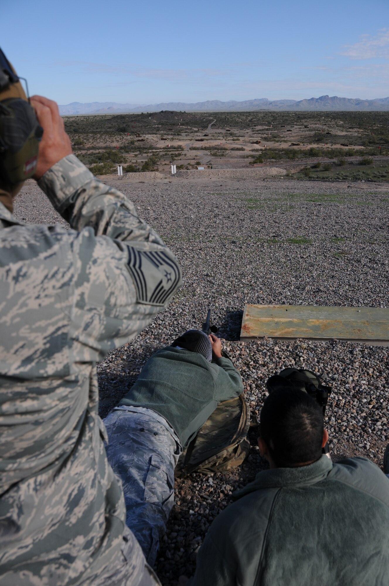 (From left to right) Chief Master Sgt. Emilio Rodriguez, Staff Sgt. Robert Ehle, and Tech. Sgt. Frank Calzadillas, Advanced Designated Marksmen from the 161st Security Forces Squadron, hone their newly acquired skills at the shooting range in Florence, Ariz., Jan. 9, 2015. ADM Airmen, or “snipers”, deliver long-range direct fire out to 600 meters and provide enhanced situational awareness through observation and reporting in peacetime and contingency operations. The 161st Security Forces Squadron is one of only eight units of the more than 100 Air National Guard units which currently have trained/qualified advanced designated marksmen. To become a certified Air Force advanced designated marksman, Airmen must attend the ADM course at Ft. Bliss, El Paso, Texas. The 11-day course familiarizes Airmen with the M24 weapon system and teaches target detection, along with distance and windage estimation. (U.S. Air National Guard photo by Tech. Sgt. Courtney Enos/Released)