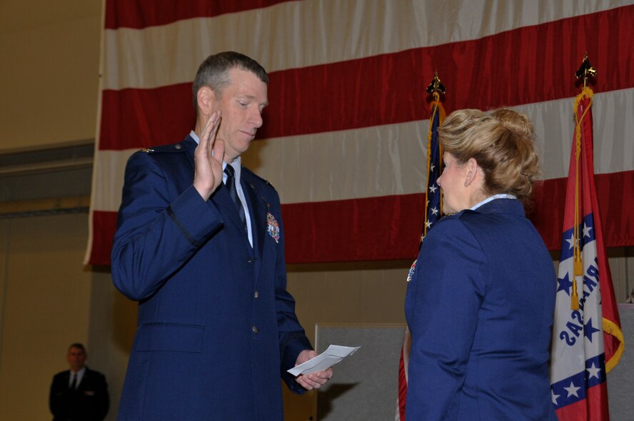 Col. Mark W. Anderson, then-188th Wing commander, administers the reaffirmation of oath to Col. Tenise Gardner, 188th Mission Support Group commander, after promoting her to colonel during a promotion ceremony held Jan. 11, 2015, at Ebbing Air National Guard Base, Fort Smith, Ark. Gardner first enlisted in the 188th in 1987 as an information manager and received her commission in 1991. This marks the second time in wing history that a female has been promoted to the rank of colonel. (U.S. Air National Guard photo by Staff Sgt. John Suleski/released)