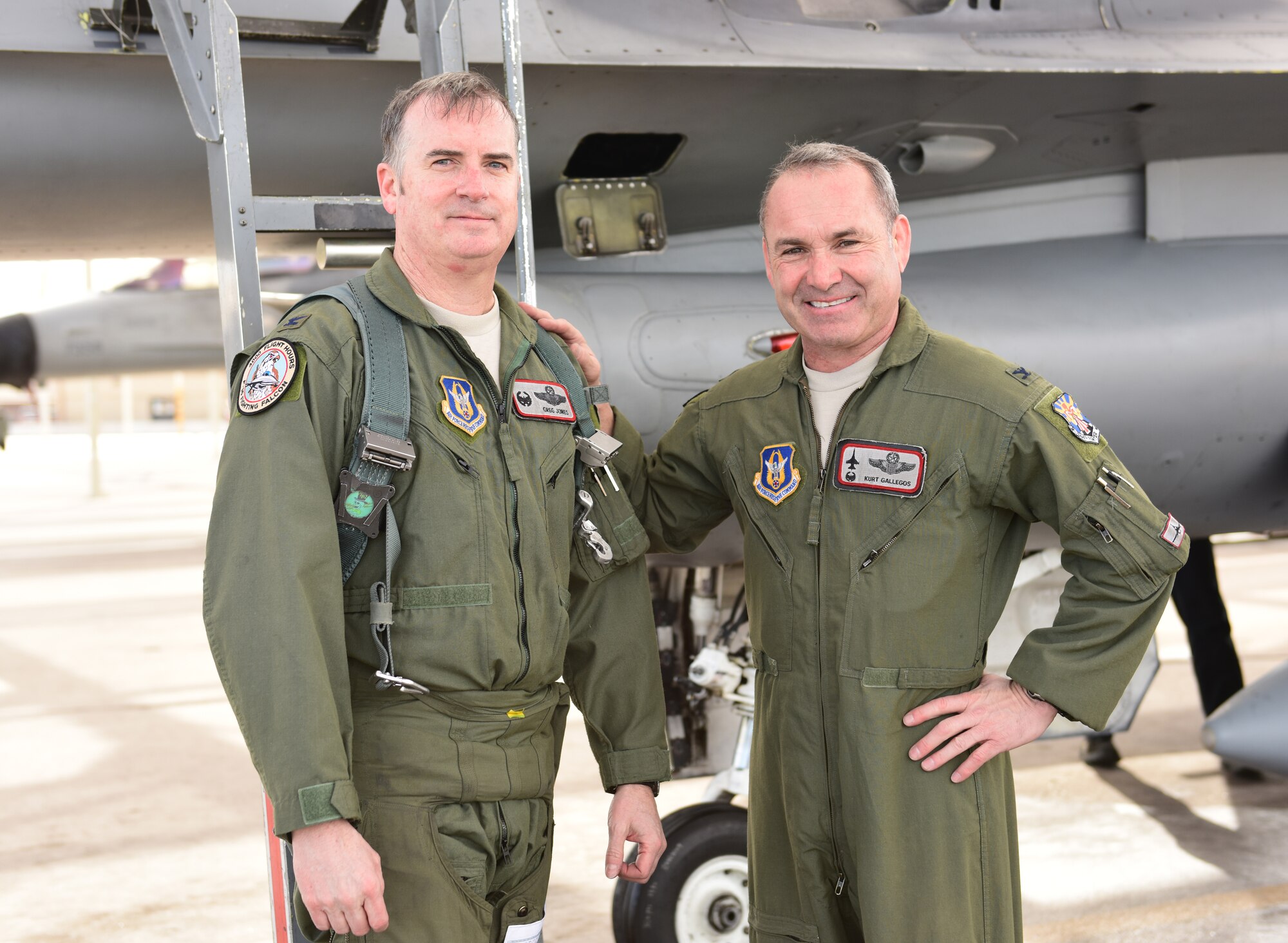 Col. Gregory Jones (right), 944th Operations Group commander, is congratulated by Col. Kurt Gallegos, 944th Fighter Wing commander, after completing 4000 hours of flying Jan. 8, 2015, at Luke Air Force Base, Ariz. Jones and Gallegos are two out of 42 pilots in the Air Force who have reached this milestone. (U.S. Air Force photo by Staff Sgt. Lausanne Kinder)