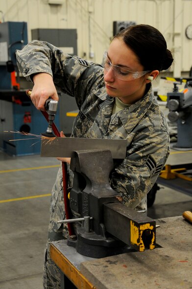 Senior Airman Caroline Haber, 446th Maintenance Squadron aircraft structural maintainer, works with steel January 10, 2015 at McChord Field, Washington. Haber, a former graphic design student, says she enjoys being a craftsman for the Air Force Reserve because at the end of the day she feels like she has accomplished something. (U.S. Air Force Reserve photo by Senior Airman Madelyn McCullough)