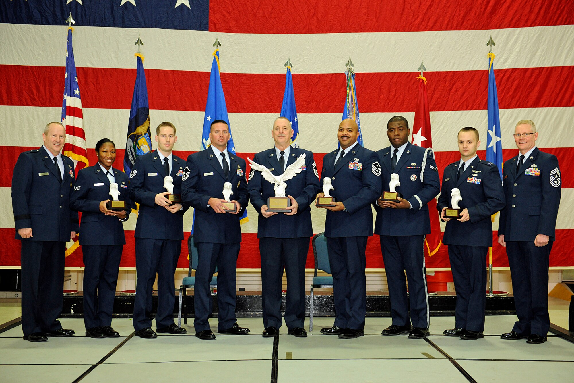 150110-Z-EZ686-195 - The 127th Wing Outstanding Airmen of the Year pose between Brig. Gen. John D. Slocum, 127th Wing Commander, and Chief Master Sgt. Robert Dobson, command chief master sergeant of the 127th Wing, for a group photo at Selfridge Air National Guard Base Mich., on Jan. 10, 2015.  The winners, from left, are Senior Airman Janea Cook, Staff Sgt. Kenneth Kirchoff, Master Sgt. Joseph Crocker, Chief Master Sgt. Dennis Barriger, Master Sgt. Maurice Graves, Airman 1st Class Emuobosan Ojaruega and Capt. Brett Devries. The Outstanding Airman of the Year ceremony is an annual formation in which airman are recognized for their achievements during the year.  (U.S. Air National Guard photo by MSgt. David Kujawa/Released)