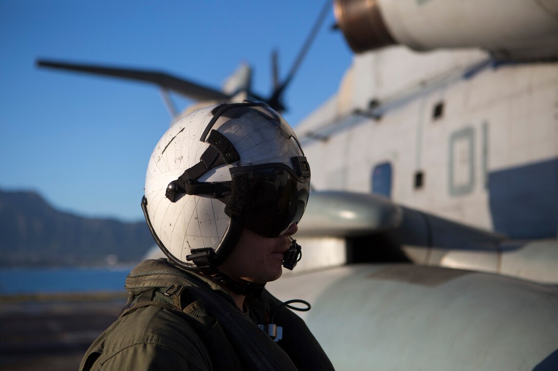 A crew member from Marine Heavy Helicopter Squadron 367 conducts pre-flight checks on a CH-53E Super Stallion, prior to departing for a visit to Pohakuloa Training Area on the Island of Hawaii, Jan. 10. Marines are currently conducting training on PTA as part of Exercise Lava Viper.  The training area is vital to the tenant commands stationed on MCB Hawaii. No other training environment within the Marine Corps provides such wide variety of operational training as the ranges among the Hawaiian Islands.