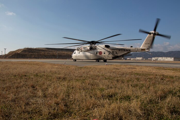 A Japan Maritime Self-Defense Force Sikorsky MH-53E minesweeping helicopter prepares to depart during the JMSDF Fleet Air Wing 31’s first flight training of the year aboard Marine Corps Air Station Iwakuni, Japan, Jan. 7, 2015. In the Japanese culture they believe a successful first flight brings good fortune for the rest of the year.