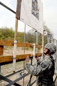 Tech. Sgt. Daniel Owczarczak of the 107th Security Forces Squadron of the New York Air National Guard marks and raises a target for a shooter during the zeroing phase of the 31st annual The Adjutant General Match held at Camp Smith, N.Y., April 16-18, 2010. Air Guard security forces personnel are deployed around the world and engaging in all Air Force security forces missions, except the Military Working Dog Program.