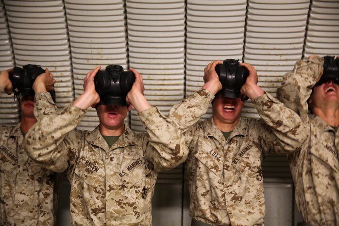 Recruits of Golf Company, 2nd Recruit Training Battaliom, endure the effects of chlorobenzylidene malonitrile, or CS gas, a non-lethal tear gas and riot control agent at Weapons and Field Training Battalion, Marine Corps Base Camp Pendleton Calif., Dec. 8. The chamber event teaches recruits how to properly employ the equipment used during biological and chemical attacks. The chamber was filled with chlorobenzylidene malonitrile, or CS gas, a non-lethal tear gas and riot control agent.