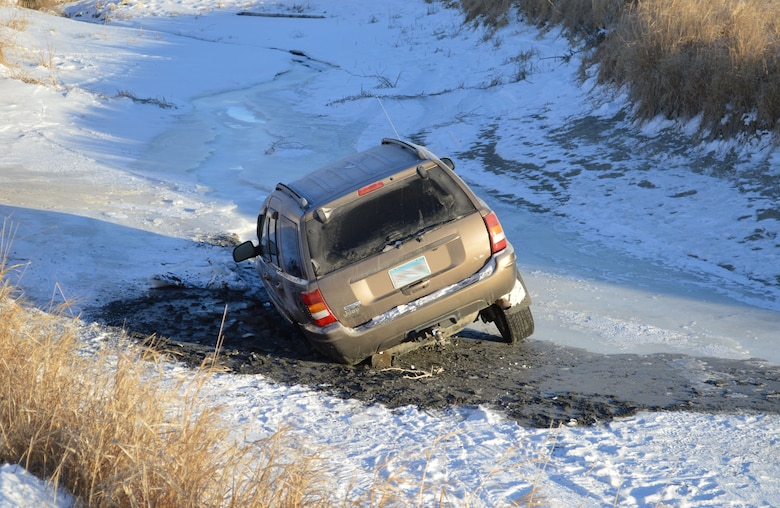 A vehicle breaks through the ice on the Missouri River in North Dakota. The driver escaped safely however driving on the ice must fall within Title 36 Regulations. The practice of "ice driving" or "ice racing" is prohibited and extremely dangerous.