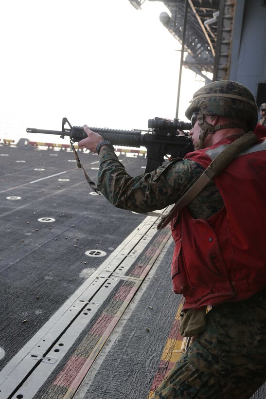 Sgt. Michael Rice, a cyber-network administrator with the 11th Marine Expeditionary Unit (MEU), and Bridgewater, New Jersey native, conducts a failure drill as part of a command element familiarization course of fire off the hangar bay of the amphibious assault ship USS Makin Island (LHD 8), Jan. 10. The Makin Island Amphibious Ready Group (ARG), and the embarked 11th MEU are deployed in support of maritime security operations and theater security cooperation efforts in the U.S. 5th Fleet and U.S. 7th Fleet areas of responsibility. (U.S. Marine Corps photos by Gunnery Sgt. Jimmy H. Bention, Jr./Released)