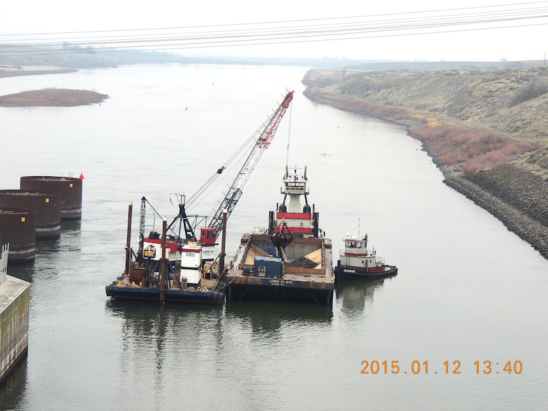 Navigation channel maintenance activities begin today (Jan. 12, 2015) in the downstream navigation lock approach at Ice Harbor Lock and Dam and in the confluence area of the Snake River near Lewiston, Idaho. Sediment removed to re-establish the federal navigation channel on the lower Snake River to Congressionally authorized dimensions of 250 feet wide by 14 feet deep at Minimum Operating Pool will be used to create additional fish habitat at Knoxway Canyon (River Mile 116) downstream of Clarkston, Wash.  