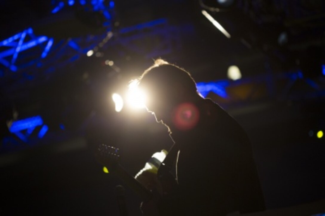 Scott Sanders, the lead guitarist for El Café Cartel, plays a guitar solo during his band’s set Jan. 10 at Unplugged, a music competition hosted by Marine Corps Community Services at the Ocean Breeze on Camp Foster. The event was open to all Status of Forces Agreement persons. MCCS “makes Okinawa home” by providing quality of life programs and services designed to meet the needs of Marines and their families, according to their website. 