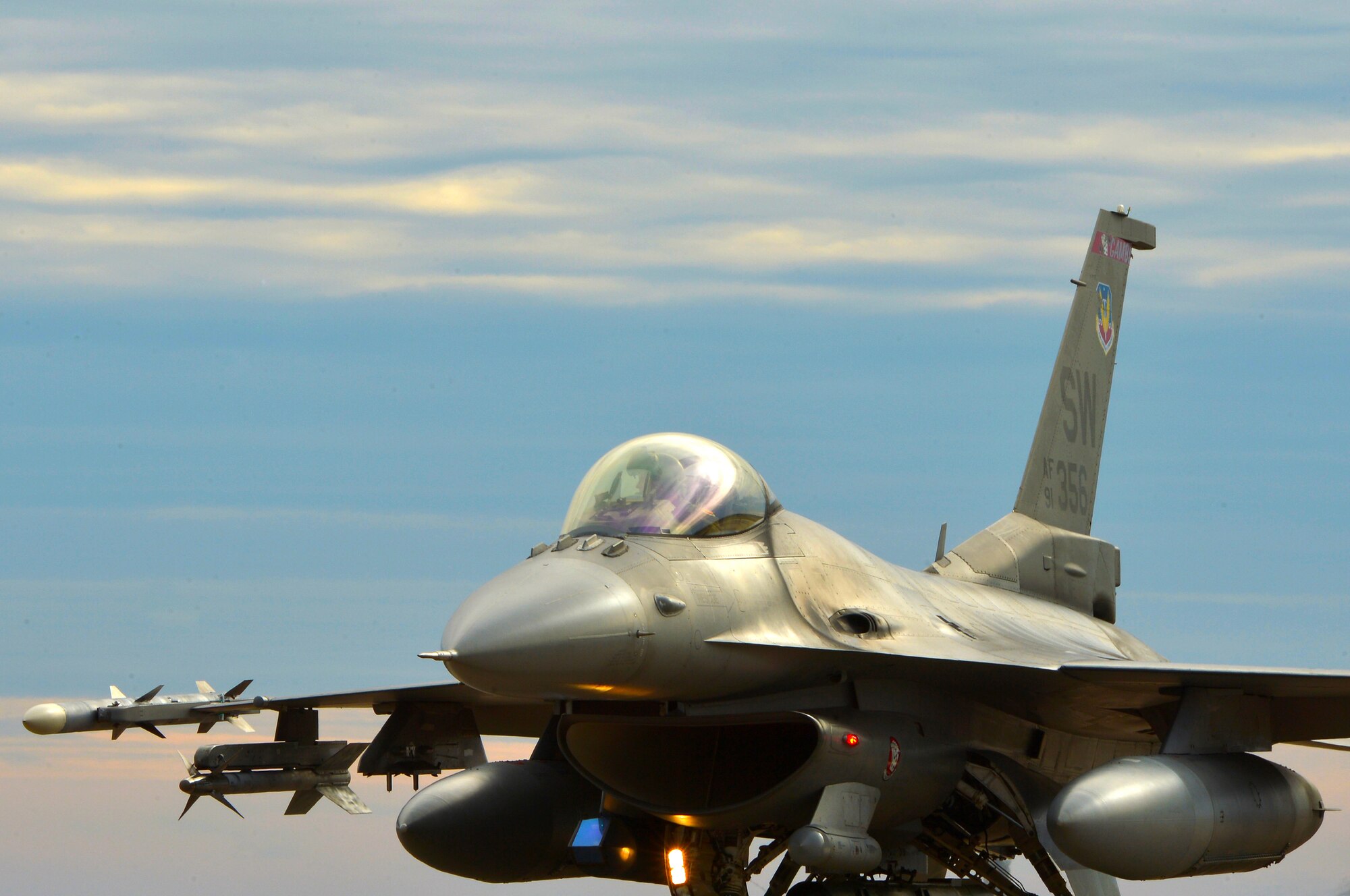 An F-16CM Fighting Falcon pilot taxis from the runway after returning from a sortie, Jan. 7, 2015, at Shaw Air Force Base, S.C. Fighter pilots assigned to the 20th Fighter Wing fly several sorties each week to maintain combat readiness. (U.S. Air Force photo by Staff Sgt. Kenny Holston/Released)