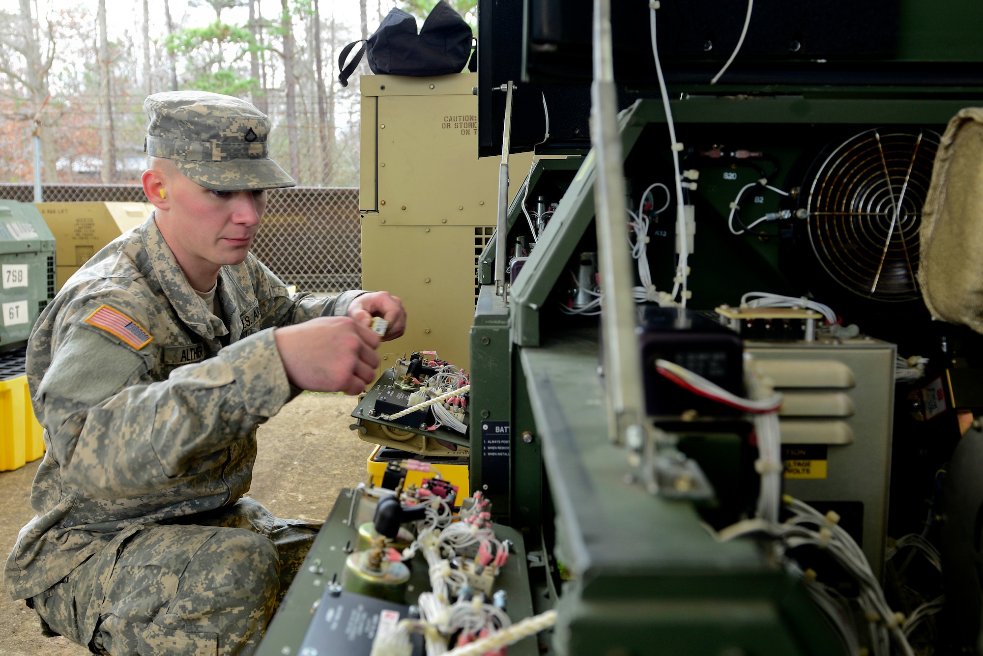 U.S. Army Pfc. Michael Althiser, 155th Inland Cargo Transfer Company, 53rd Transportation Battalion (Movement Control), 7th Transportation Brigade (Expeditionary) power generation equipment repairer, assembles a generator at the 155th ICTC motor pool at Fort Eustis, Va., Jan. 7, 2015. The motor pool is home to a variety of military vehicles and generators.  (U.S. Air Force photo by Senior Airman Kimberly Nagle/Released)