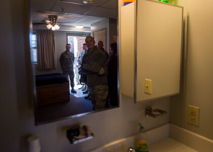 Lt. Gen. Carlton D. Everhart II, 18th Air Force commander, takes a look around an Airman’s dormitory to get a feel for the quality of life provided to junior enlisted Airmen Jan. 8, 2015, at Joint Base Charleston S.C., as part of his tour here. While visiting JB Charleston, the general toured the 437th Maintenance Group, the 437th Aerial Port Squadron, the 437th Operations Support Squadron and other units across the wing to interact with the Airmen and civilians who work to provide precise, reliable airlift worldwide every day.  (U.S. Air Force photo/Senior Airman Jared Trimarchi)  