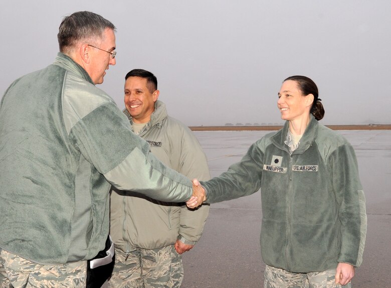 GRAND FORKS AIR FORCE BASE, N.D. – General John Hyten, Air Force Space Command commander, greets Lt. Col. Michelle Kneupper, 10th Space Warning Squadron commander, Dec. 22. During his visit, Hyten toured Cavalier Air Force Station and the Perimeter Acquisition Radar building and met with Airmen from the 10th SWS. The 10th SWS, located 15 miles south of the Canadian border, is one of the six installations operated by the 21st Space Wing, and provides missile warning and space surveillance data to North American Aerospace Defense Command, United States Strategic Command and regional combatant commanders. (U.S. Air Force photo)